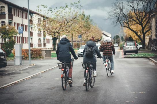 three bikers on the local street