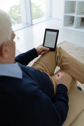 Senior with e-reader